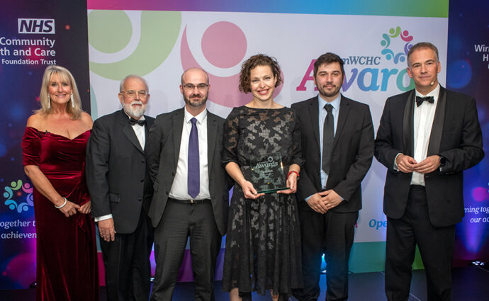 Member of staff accepting award