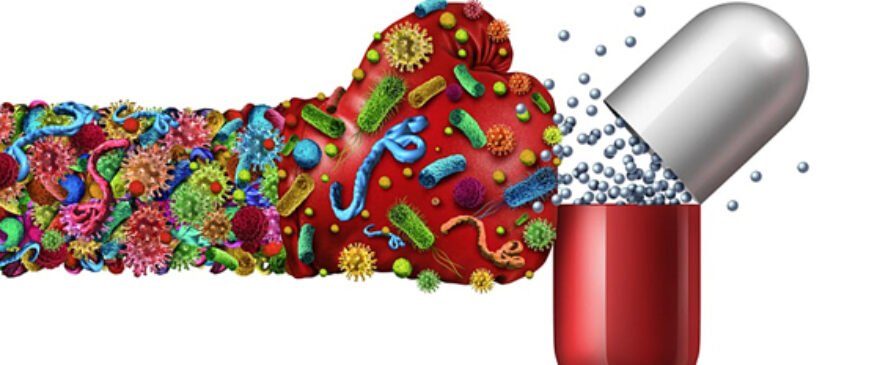 Microbes depicted as a boxing glove 'punching' antibiotic pill