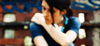 Image of young person looking sad.